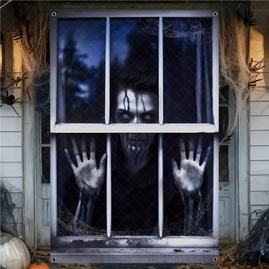 A Halloween window decal or wall mural showing a creepy zombie face behind barred windows, with pale hands reaching out. The decal is displayed on a house exterior door surrounded by spiderwebs, cobwebs, and a pumpkin.