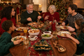 Family enjoying Christmas dinner around a festive table